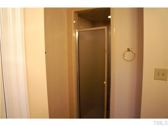 8434 Wycombe Lane Raleigh, NC 27615 - Photo 11 of 19 In addition to separate tub, master bath has a separate shower as well.
