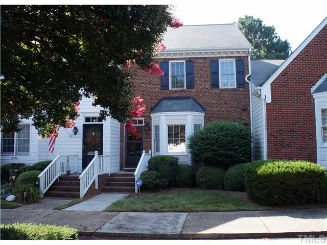 8434 Wycombe Lane Raleigh, NC 27615 - Photo 2 of 19 Great townhome with brick front, assigned parking spots, tennis, pool and lush landscaping.