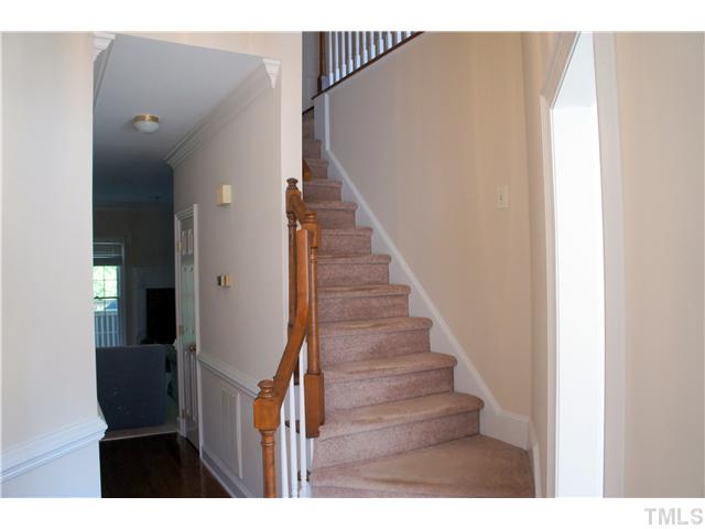 8434 Wycombe Lane Raleigh, NC 27615 - Photo 3 of 19 Hardwood floor entry way leads to eat-in kitchen, upstairs bedrooms, and great room/ formal dining room.