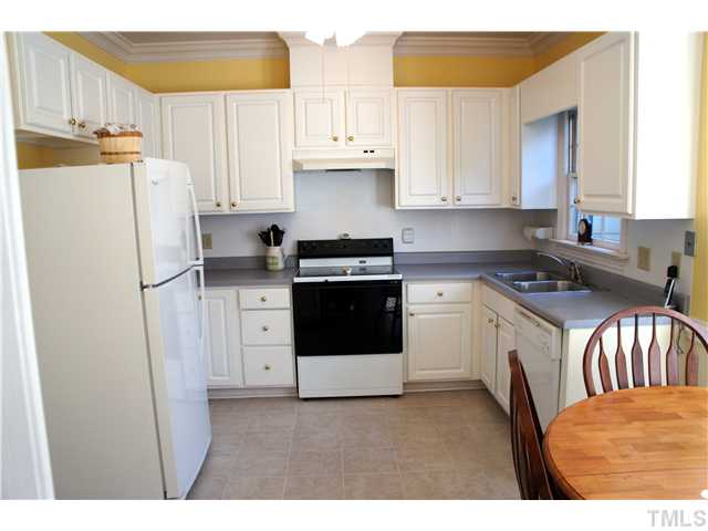 8434 Wycombe Lane Raleigh, NC 27615 - Photo 4 of 19 Crisp and clean kitchen with new tile flooring.