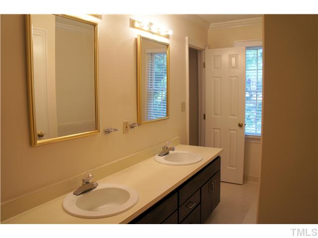 8434 Wycombe Lane Raleigh, NC 27615 - Photo 9 of 19 Double vanities and tile floors.