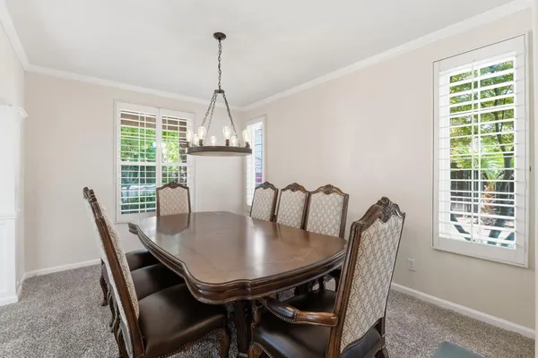 a view of a dining room with furniture