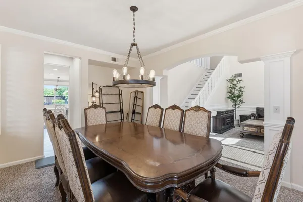 a view of a dining room with furniture window and outside view