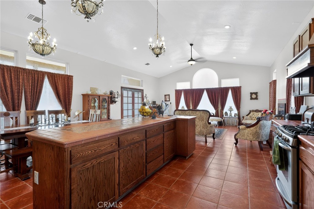 11701 Back Canyon Road Caliente, CA 93518 - Photo 11 of 26 a large kitchen with lots of counter space a sink appliances and living room view