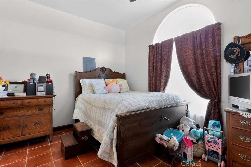 11701 Back Canyon Road Caliente, CA 93518 - Photo 13 of 26 a bedroom with a bed and a tv