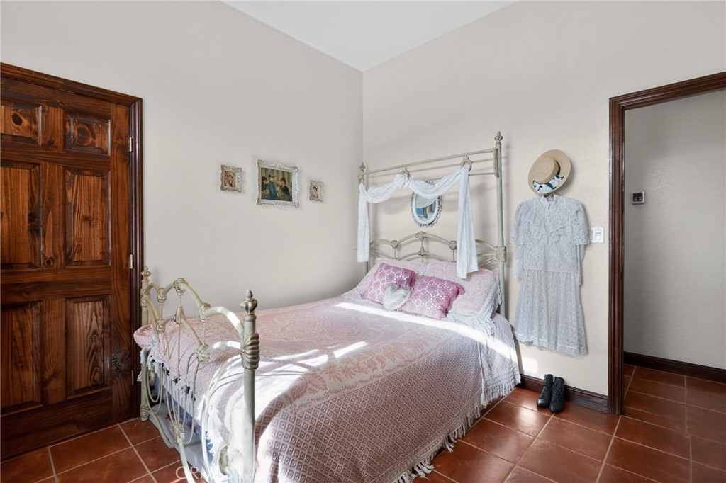 11701 Back Canyon Road Caliente, CA 93518 - Photo 16 of 26 a bedroom with a bed and a mirror