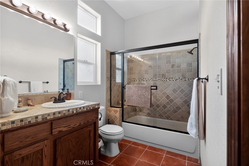 11701 Back Canyon Road Caliente, CA 93518 - Photo 18 of 26 a bathroom with a granite countertop sink mirror vanity and toilet