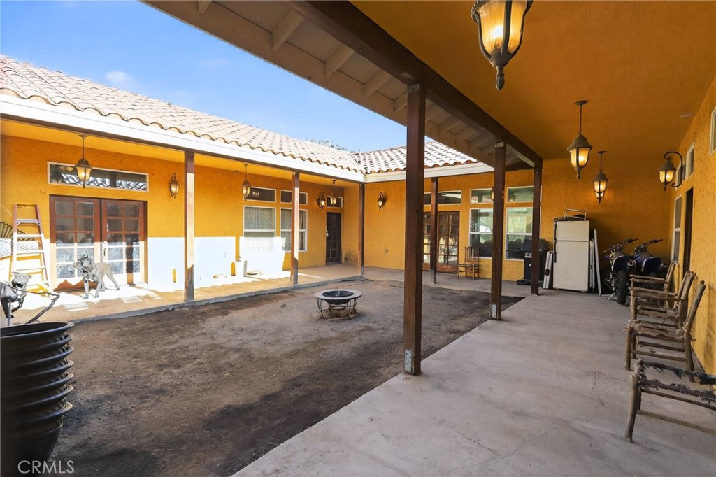 11701 Back Canyon Road Caliente, CA 93518 - Photo 4 of 26 a swimming pool with outdoor seating and a porch