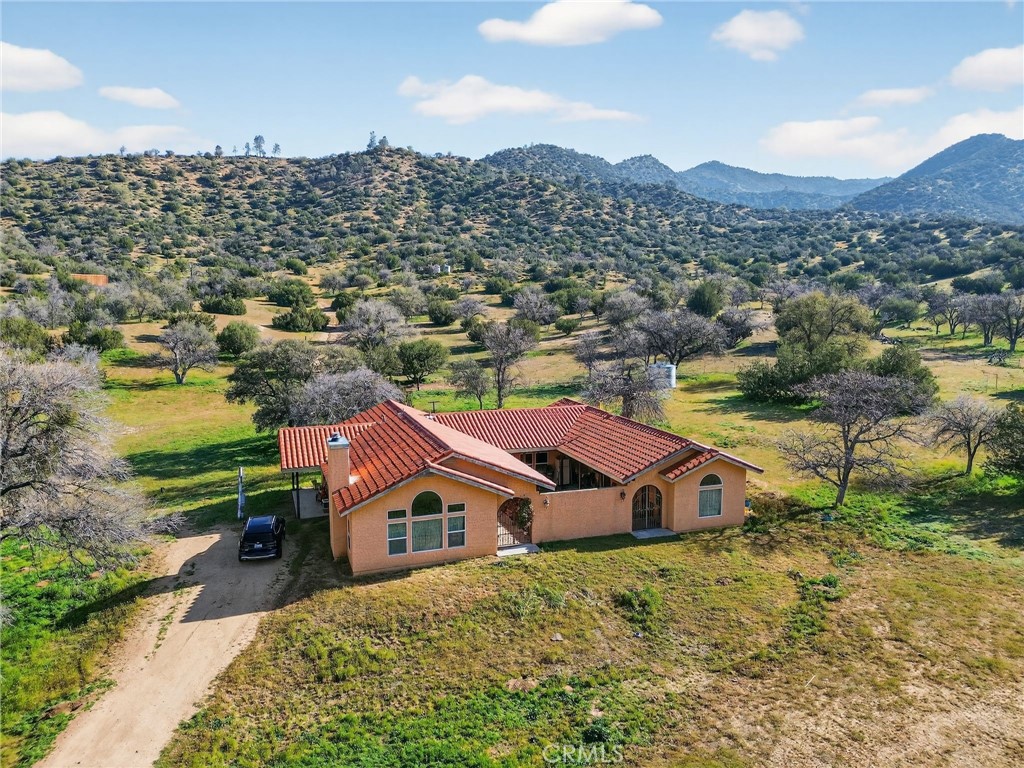 11701 Back Canyon Road Caliente, CA 93518 - Photo 6 of 26 a view of a house with a mountain in the background
