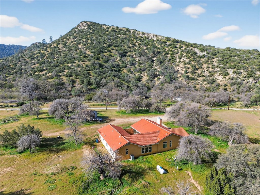 11701 Back Canyon Road Caliente, CA 93518 - Photo 7 of 26 a aerial view of a house with a yard and lake view