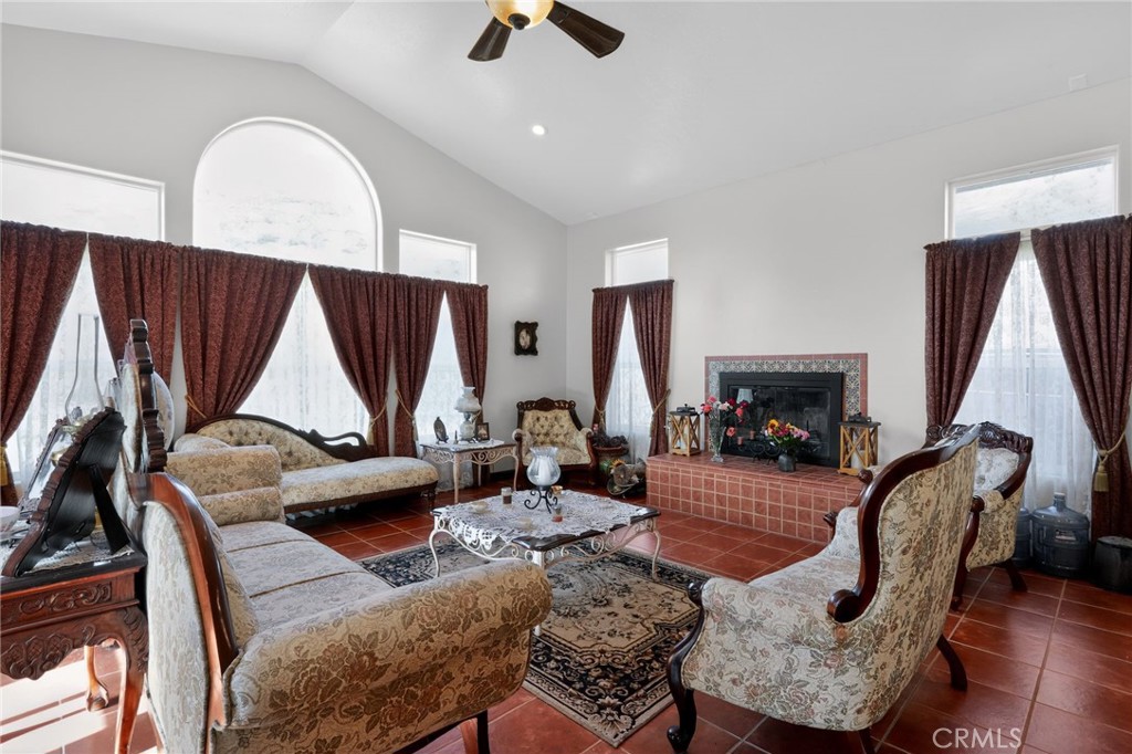 11701 Back Canyon Road Caliente, CA 93518 - Photo 9 of 26 a living room with furniture a rug and a fireplace