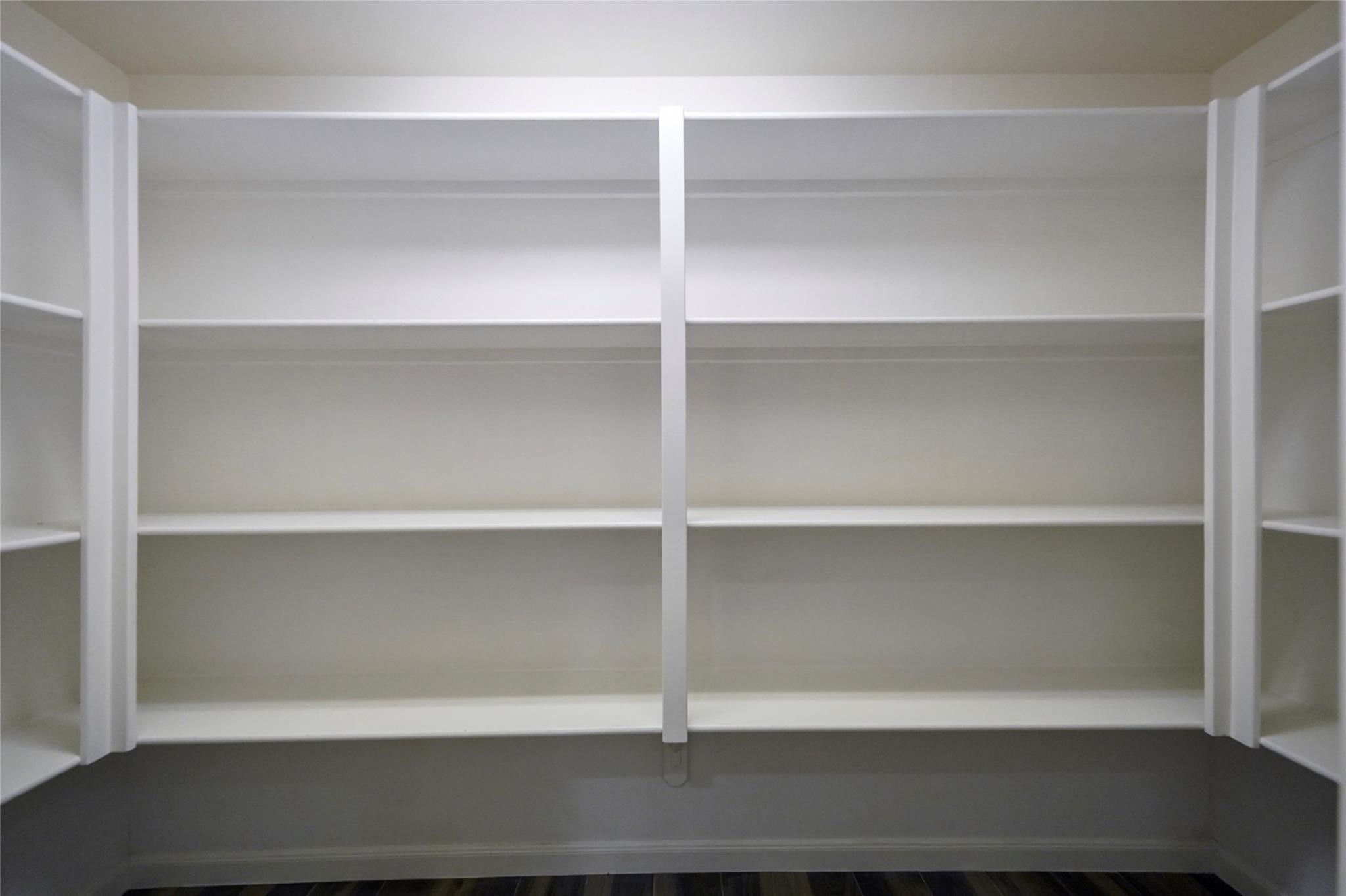 30720 Waller Spring Creek Road Waller, TX 77484 - Photo 7 of 22 Spacious walk-in pantry, offering ample storage and organization for all your culinary needs. This feature enhances the functionality and convenience of the kitchen, making meal preparation and food storage effortless.