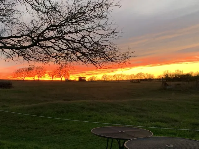 a view of a field with an outdoor space