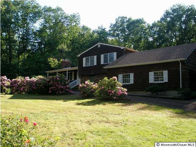 76 Yellow Meetinghouse Road Cream Ridge, NJ 08514 - Photo 1 of 3 a front view of a house with a garden