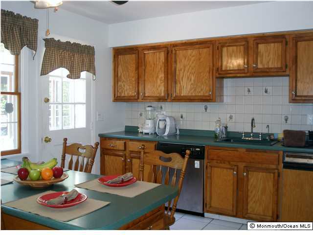 76 Yellow Meetinghouse Road Cream Ridge, NJ 08514 - Photo 2 of 3 a kitchen with stainless steel appliances granite countertop wooden cabinets a stove top oven a sink and dishwasher