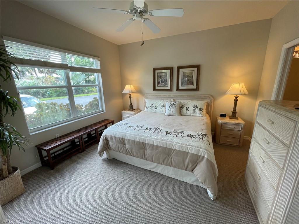 519 Roma Court, Unit 2103 Naples, FL 34110 - Photo 11 of 27 a bedroom with a bed and a window