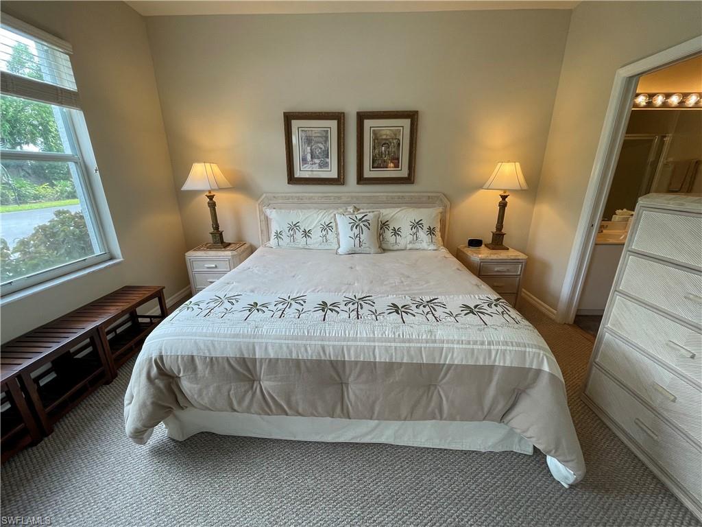 519 Roma Court, Unit 2103 Naples, FL 34110 - Photo 12 of 27 a bedroom with a bed and window