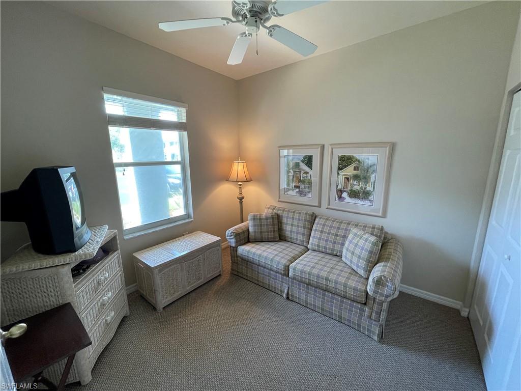 519 Roma Court, Unit 2103 Naples, FL 34110 - Photo 19 of 27 a living room with furniture and a window