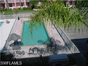 519 Roma Court, Unit 2103 Naples, FL 34110 - Photo 23 of 27 a view of swimming pool from a balcony