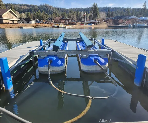 a view of swimming pool with outdoor seating and city view