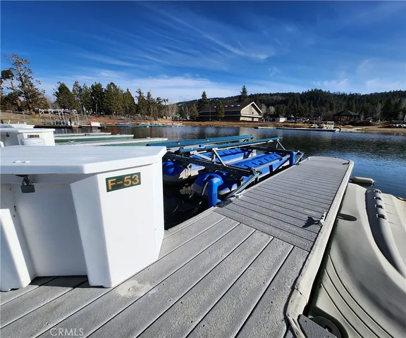 a view of a balcony with wooden floor and city view