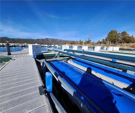 a view of a balcony with wooden floor and city view