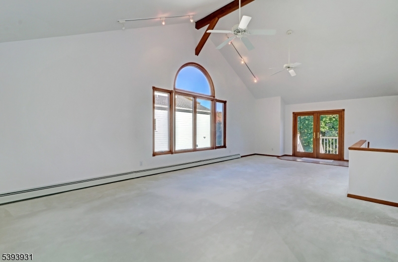 6 Roscoe Avenue Madison, NJ 07940 - Photo 5 of 8 a view of empty room with windows and air conditioner