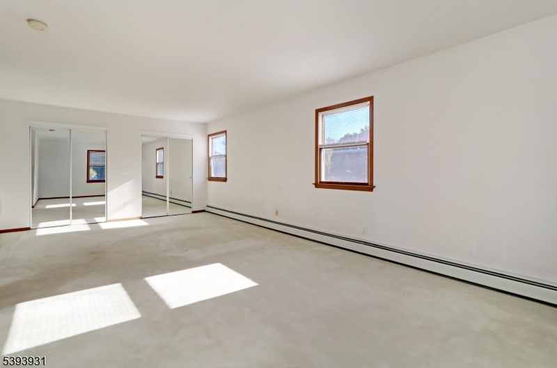 6 Roscoe Avenue Madison, NJ 07940 - Photo 7 of 8 an empty room with windows