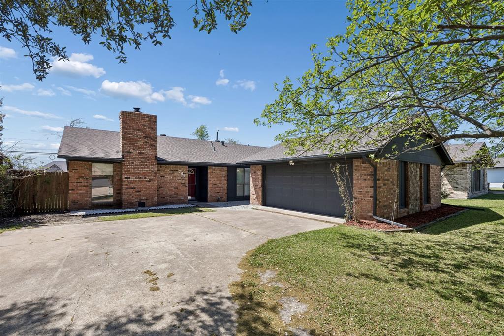 709 Bowie Street Forney, TX 75126 - Photo 1 of 27 a front view of a house with a yard and garage