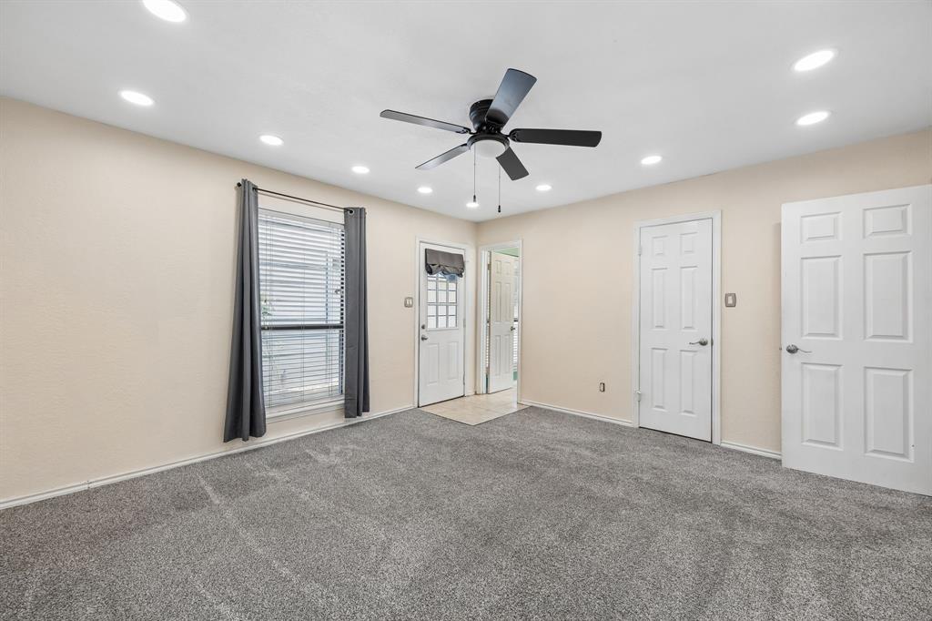 709 Bowie Street Forney, TX 75126 - Photo 17 of 27 a view of an empty room and a ceiling fan