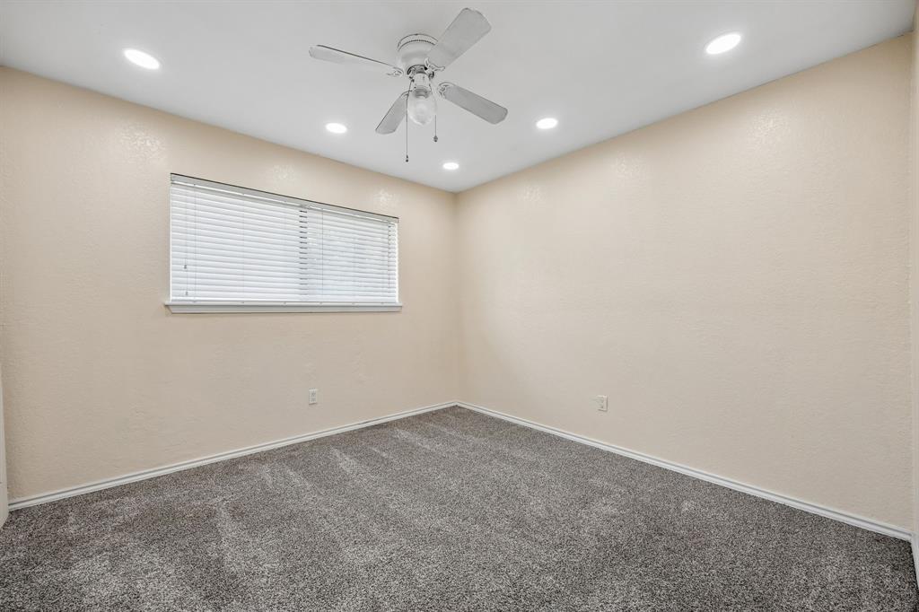 709 Bowie Street Forney, TX 75126 - Photo 22 of 27 an empty room with a window