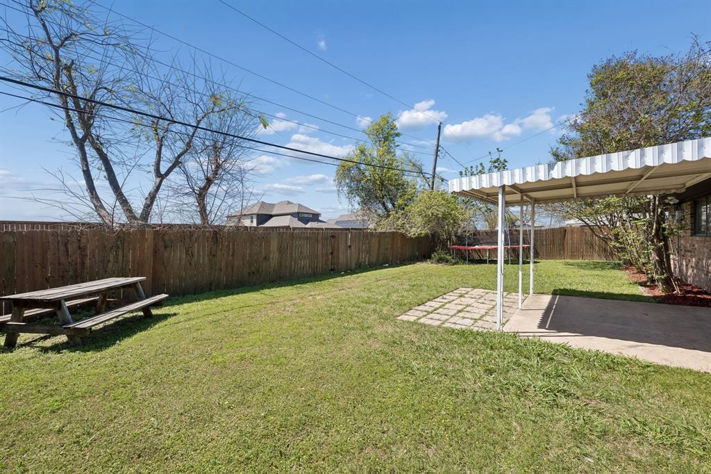 709 Bowie Street Forney, TX 75126 - Photo 24 of 27 a view of a backyard