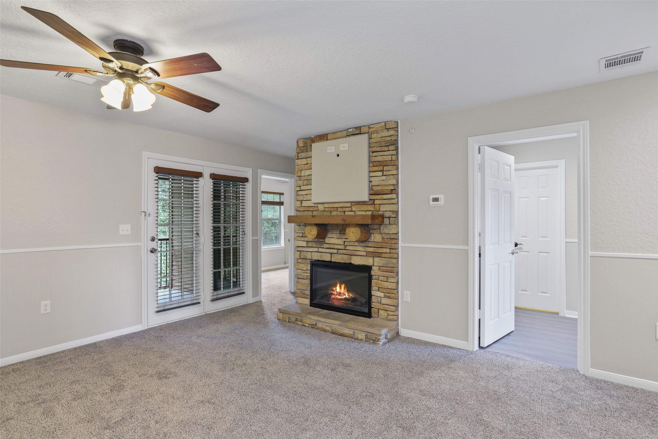 11700 League Line Road, Unit 122 Conroe, TX 77304 - Photo 13 of 25 a living room with furniture and a fireplace