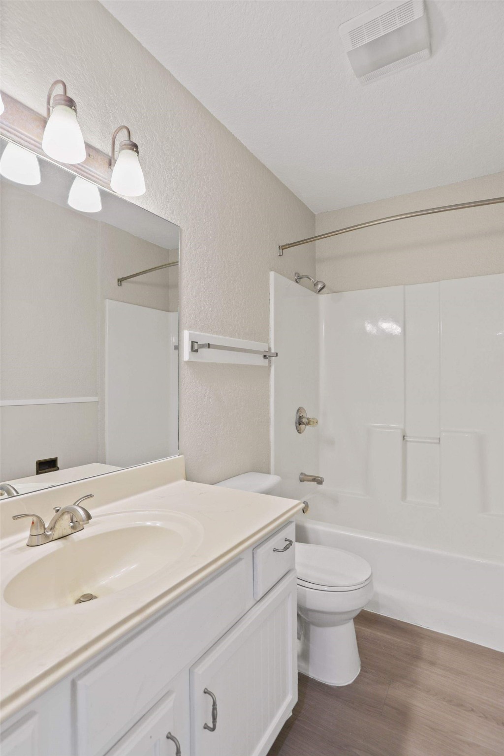 11700 League Line Road, Unit 122 Conroe, TX 77304 - Photo 18 of 25 a bathroom with a granite countertop sink a toilet and shower