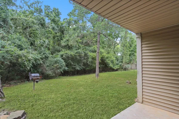 a backyard of a house with lots of green space