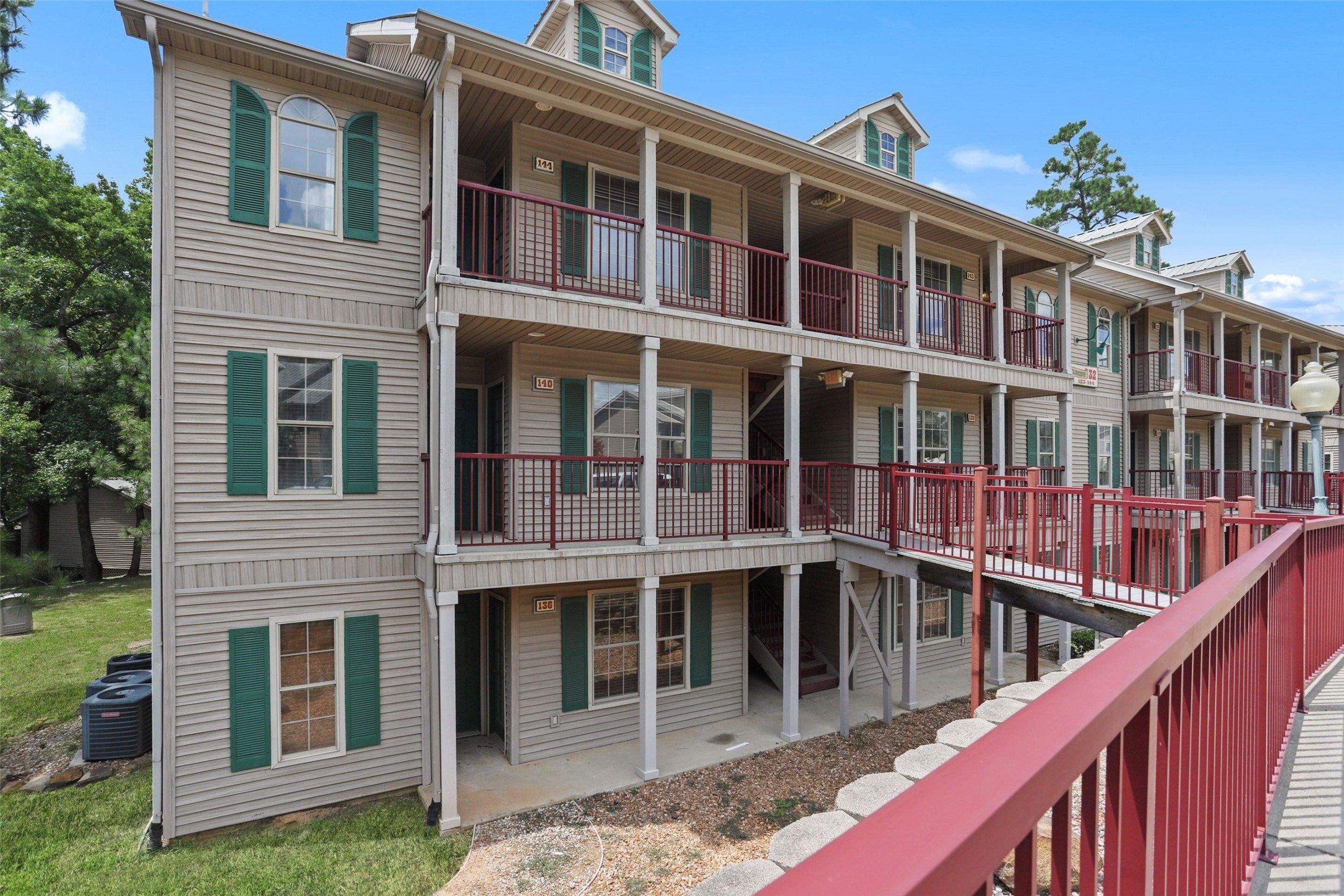 11700 League Line Road, Unit 122 Conroe, TX 77304 - Photo 24 of 25 a view of a brick building next to a yard