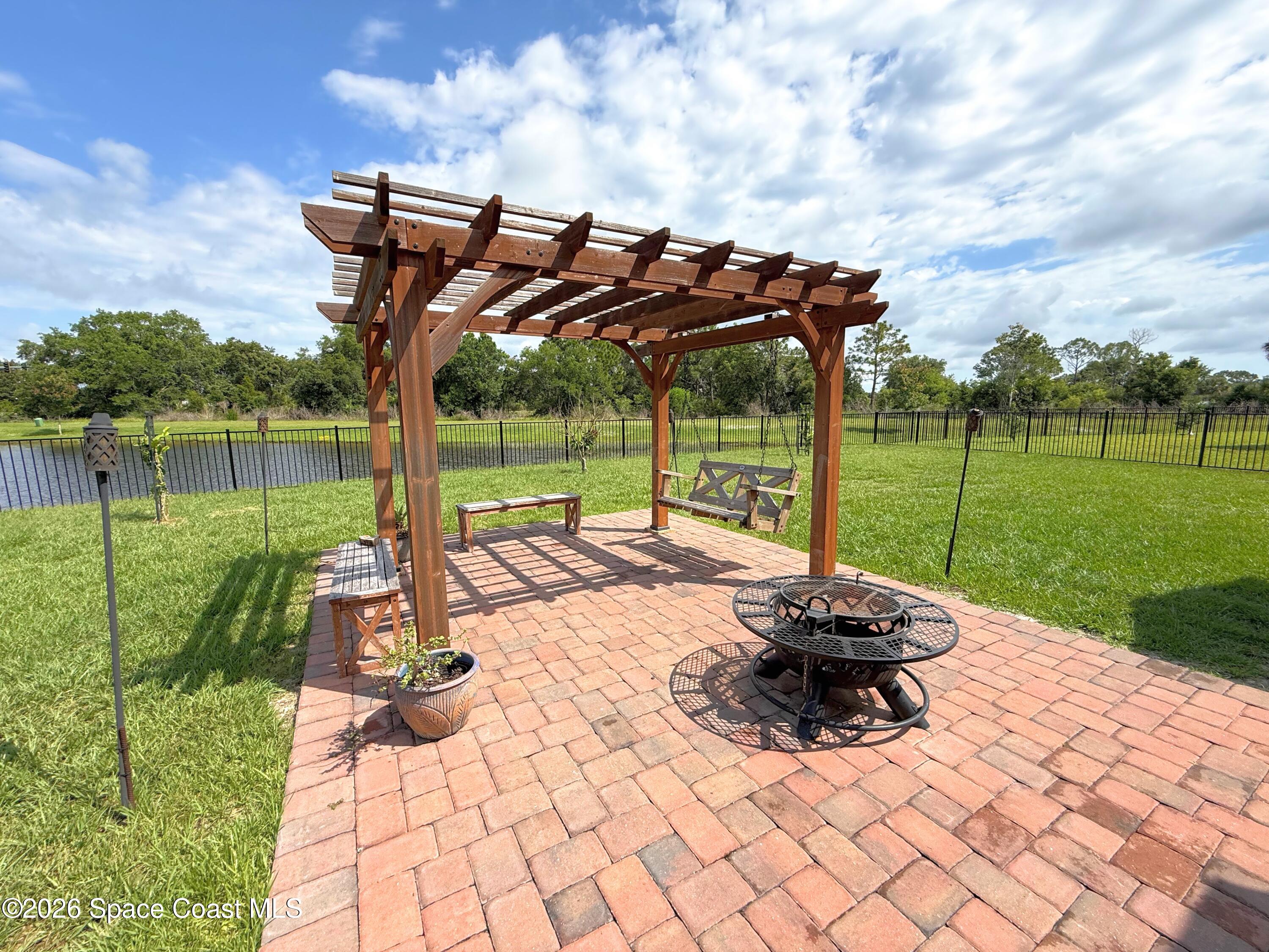 1873 Farmhouse Road Southeast Palm Bay, FL 32909 - Photo 24 of 35 Pergola and patio swing