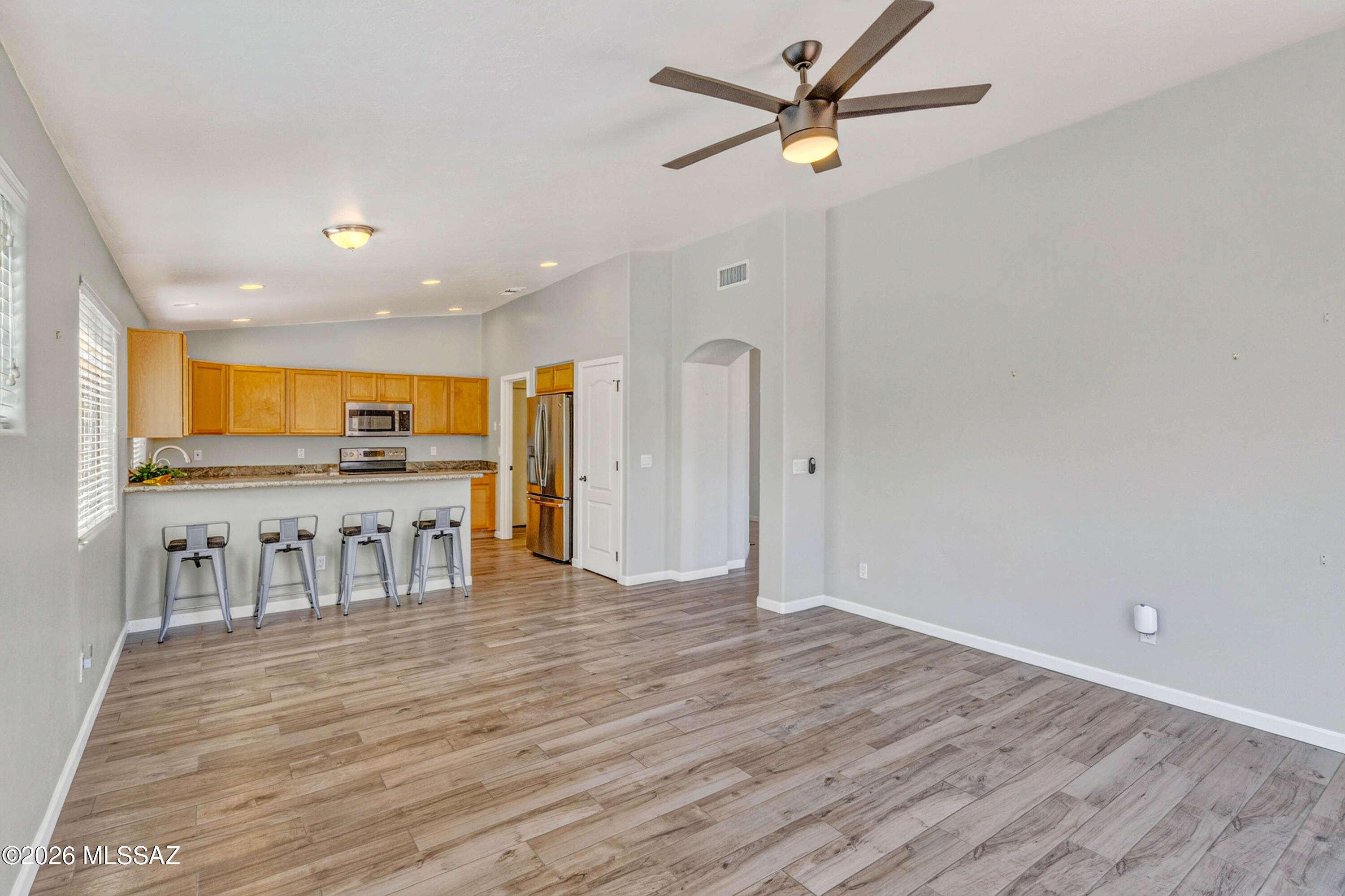 446 West Silvertip Road Tucson, AZ 85737 - Photo 19 of 51 Living Room Leads Into Kitchen