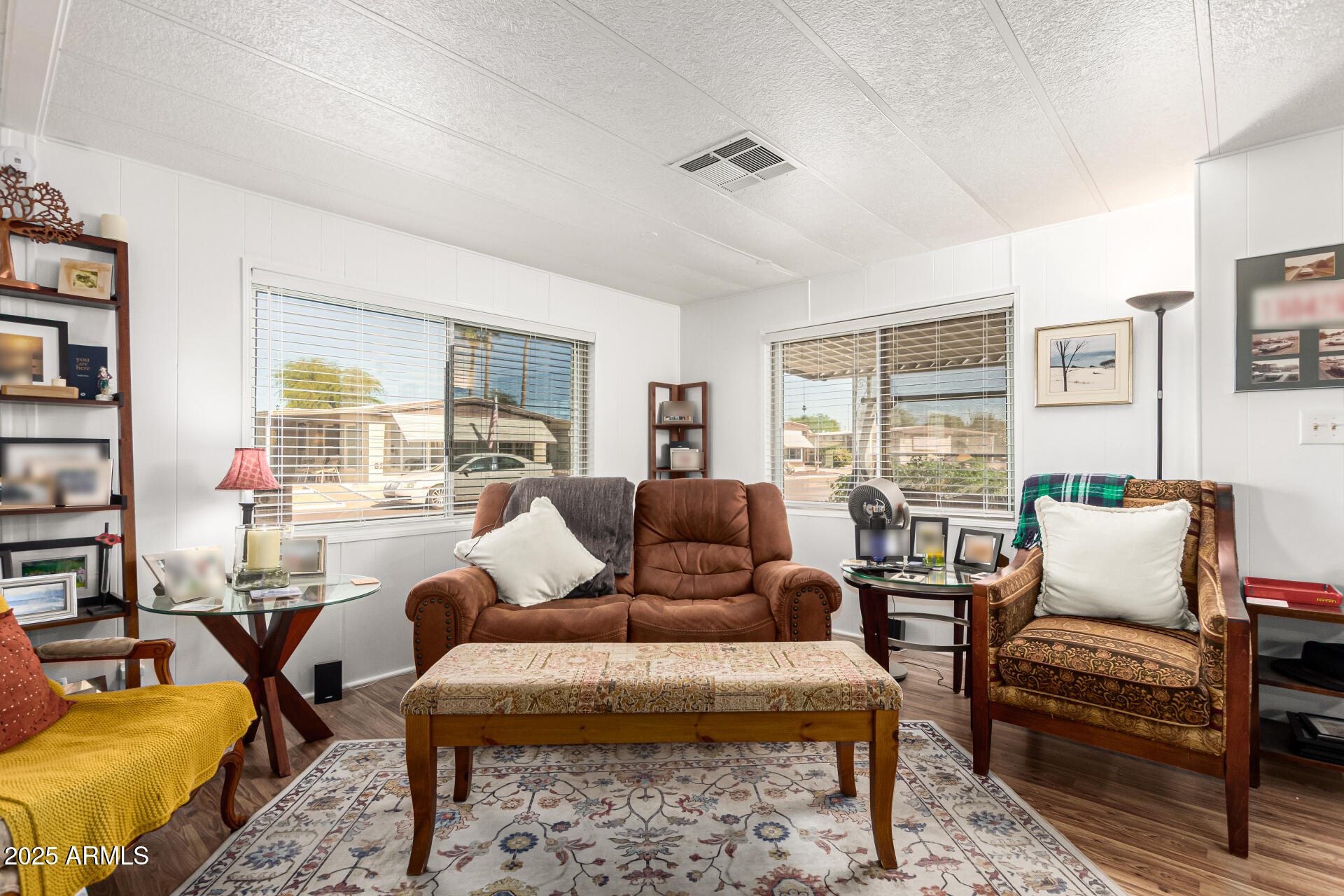 661 South Hawes Road, Unit 52 Mesa, AZ 85208 - Photo 11 of 36 a living room with furniture wooden floor and a large window