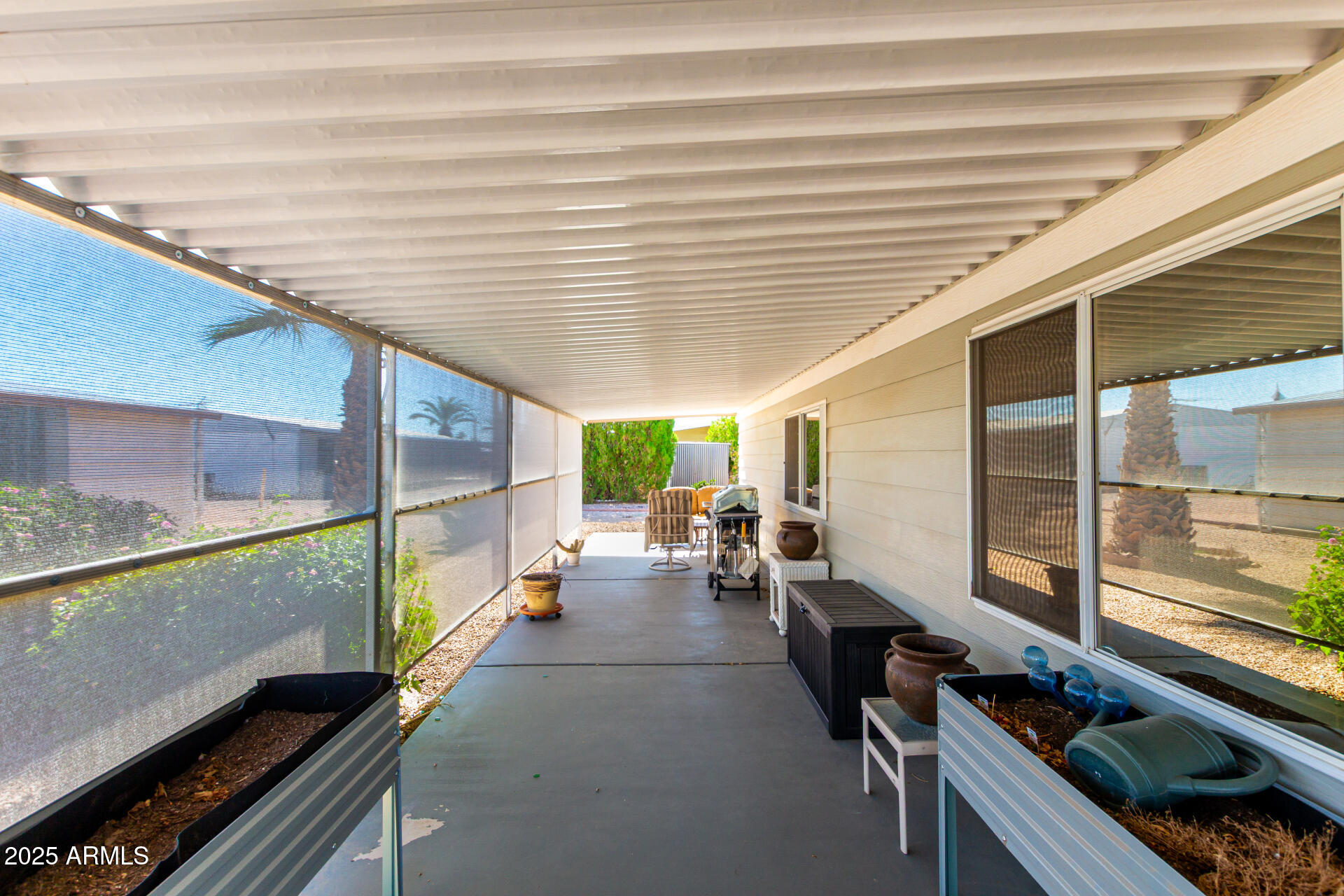 661 South Hawes Road, Unit 52 Mesa, AZ 85208 - Photo 13 of 36 a view of a patio with table and chairs