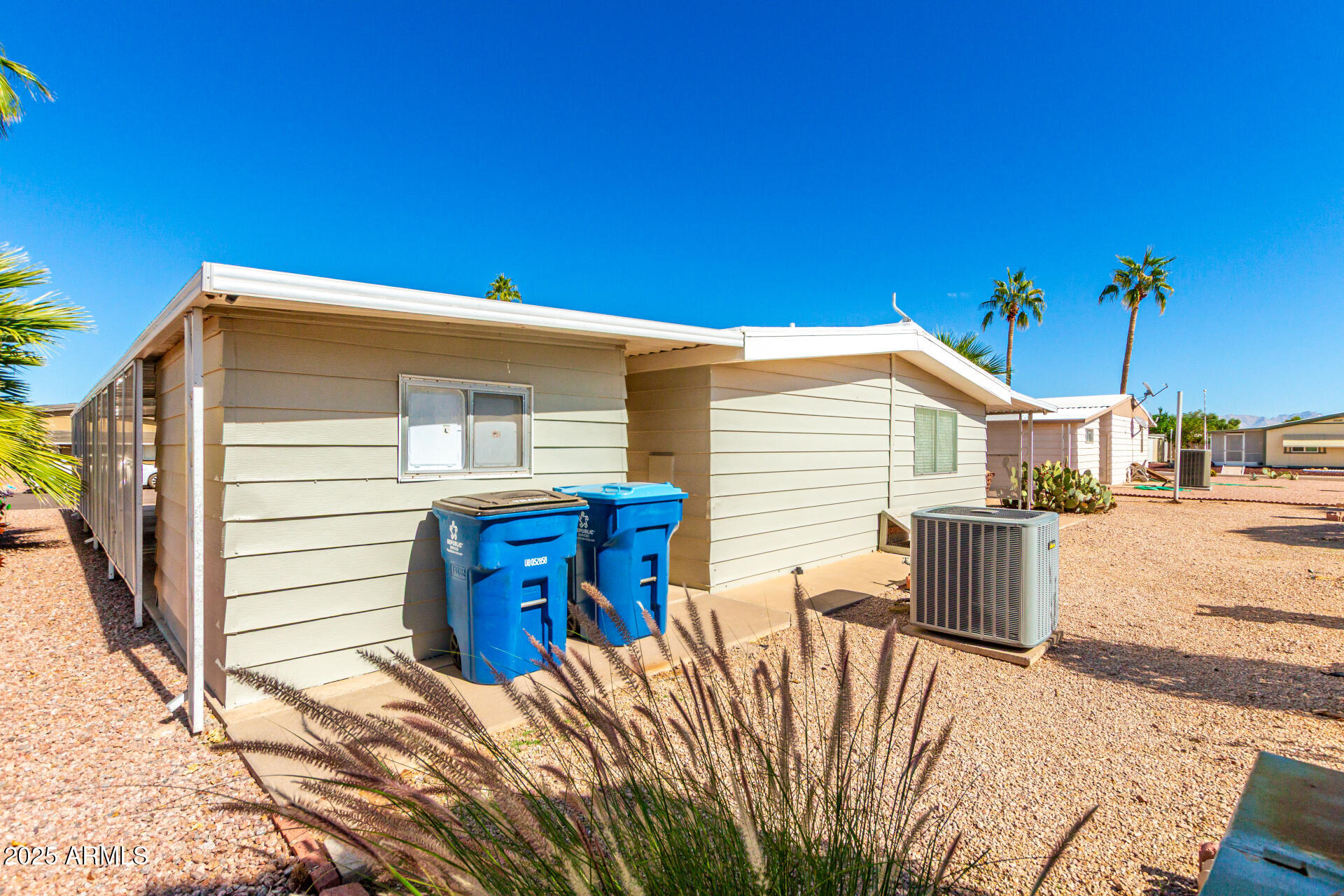 661 South Hawes Road, Unit 52 Mesa, AZ 85208 - Photo 16 of 36 a view of a house with backyard and sitting area
