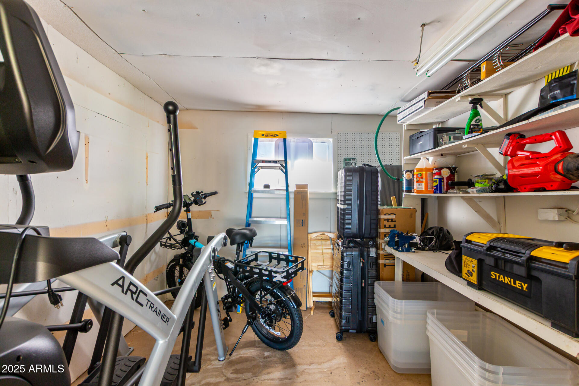 661 South Hawes Road, Unit 52 Mesa, AZ 85208 - Photo 17 of 36 a storage room with furniture a rug and a window