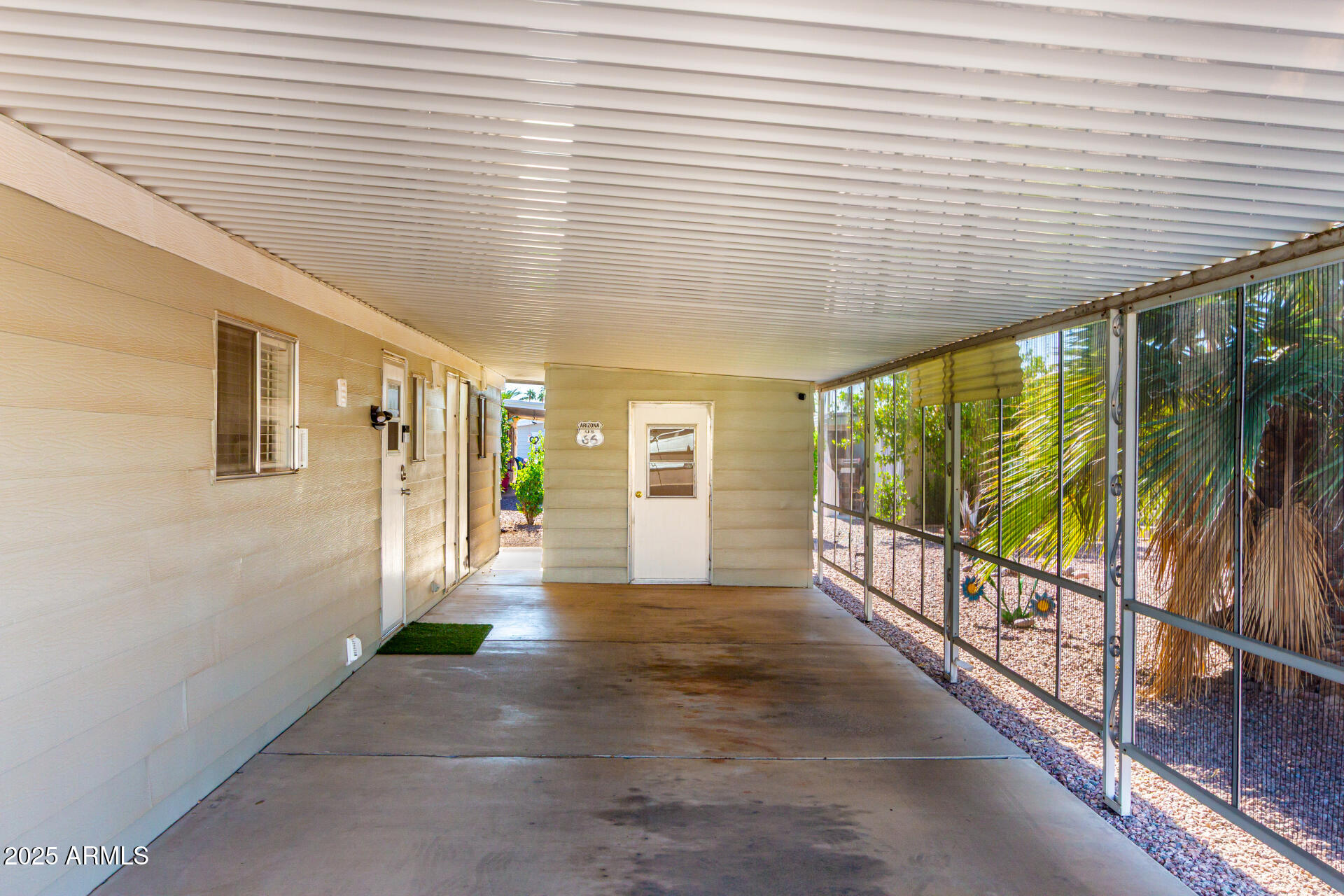 661 South Hawes Road, Unit 52 Mesa, AZ 85208 - Photo 18 of 36 a view of a porch with wooden floor