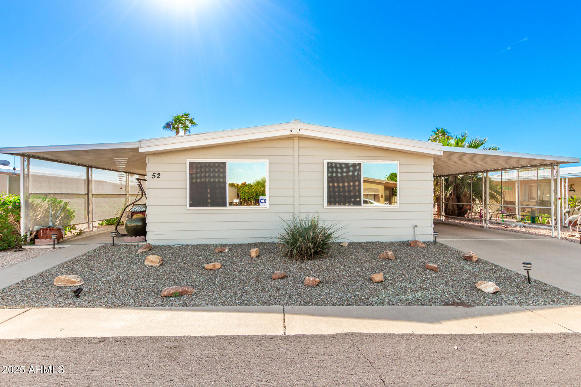 661 South Hawes Road, Unit 52 Mesa, AZ 85208 - Photo 19 of 36 a front view of a house with yard