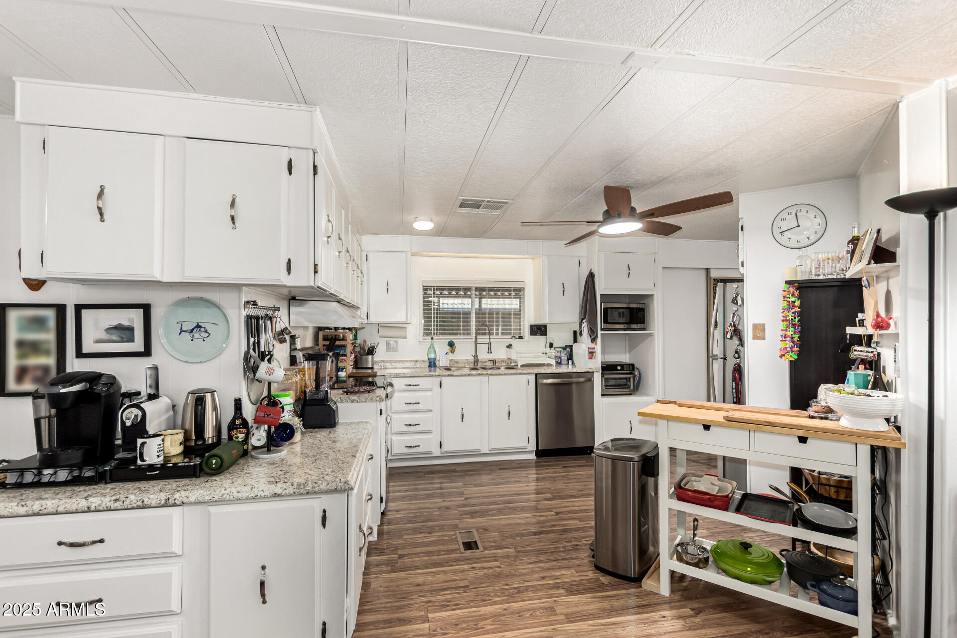 661 South Hawes Road, Unit 52 Mesa, AZ 85208 - Photo 2 of 36 a kitchen with stainless steel appliances kitchen island granite countertop a sink and cabinets