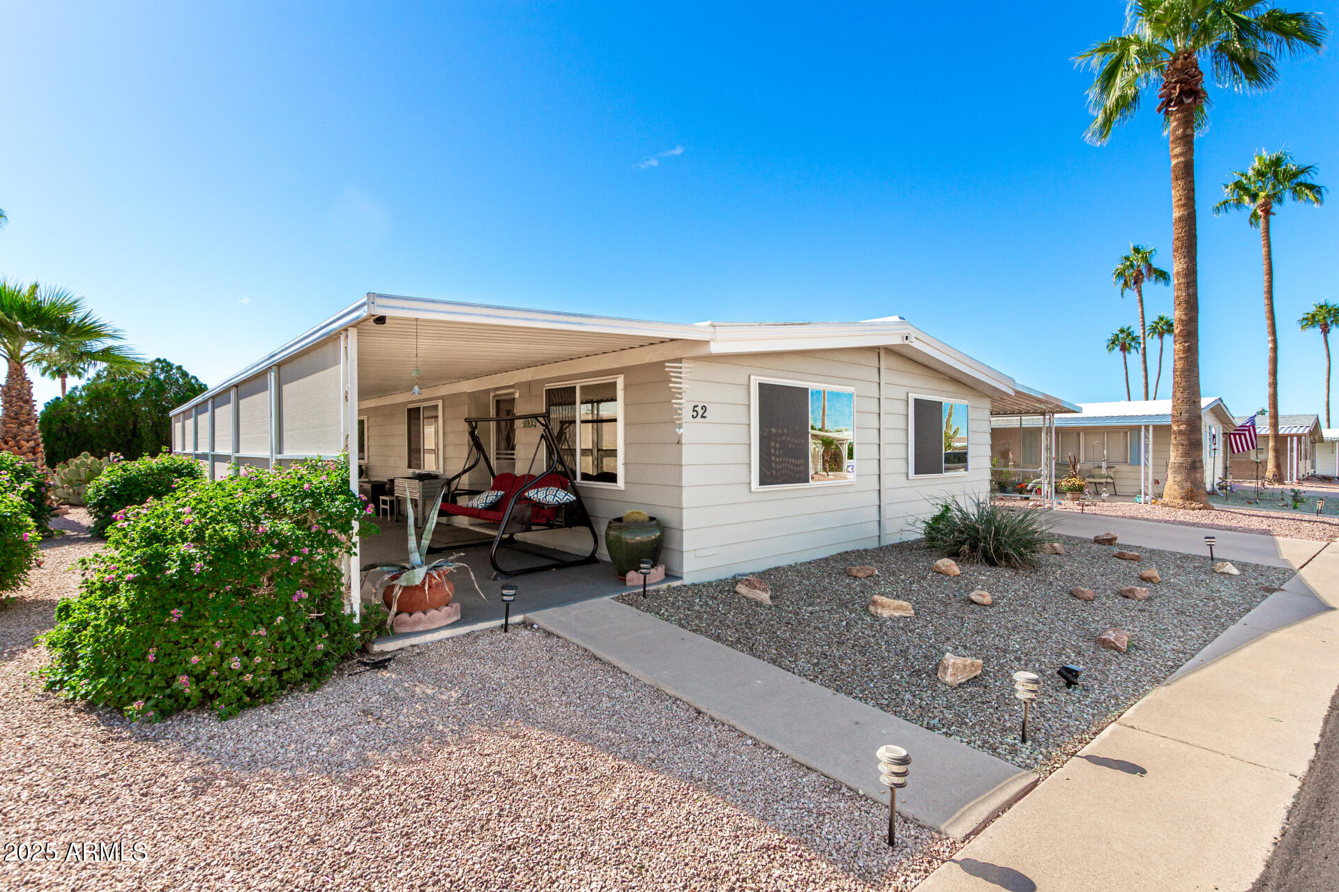 661 South Hawes Road, Unit 52 Mesa, AZ 85208 - Photo 22 of 36 a view of a house with a patio