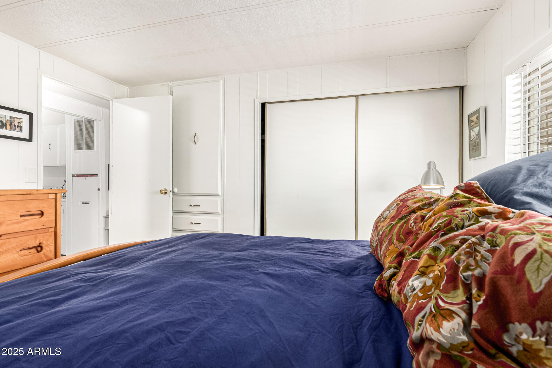 661 South Hawes Road, Unit 52 Mesa, AZ 85208 - Photo 27 of 36 a bedroom with a bed and a dresser