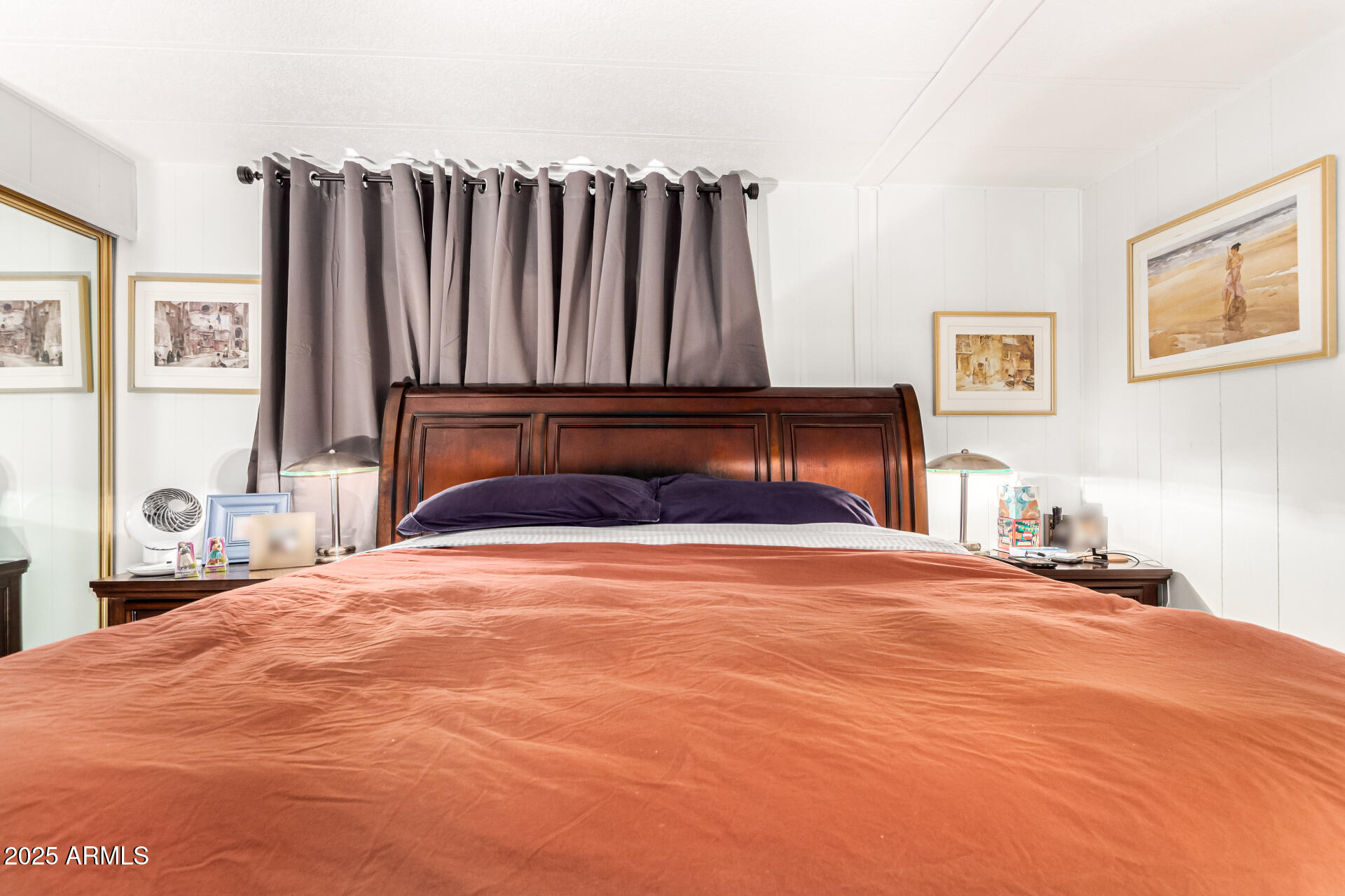 661 South Hawes Road, Unit 52 Mesa, AZ 85208 - Photo 30 of 36 a bedroom with a bed and a large mirror