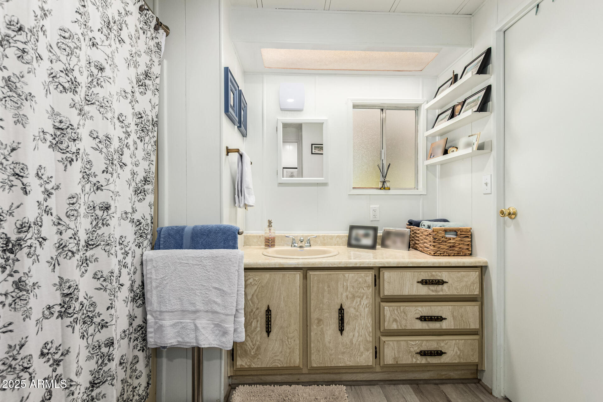 661 South Hawes Road, Unit 52 Mesa, AZ 85208 - Photo 33 of 36 a bathroom with a sink toilet and mirror