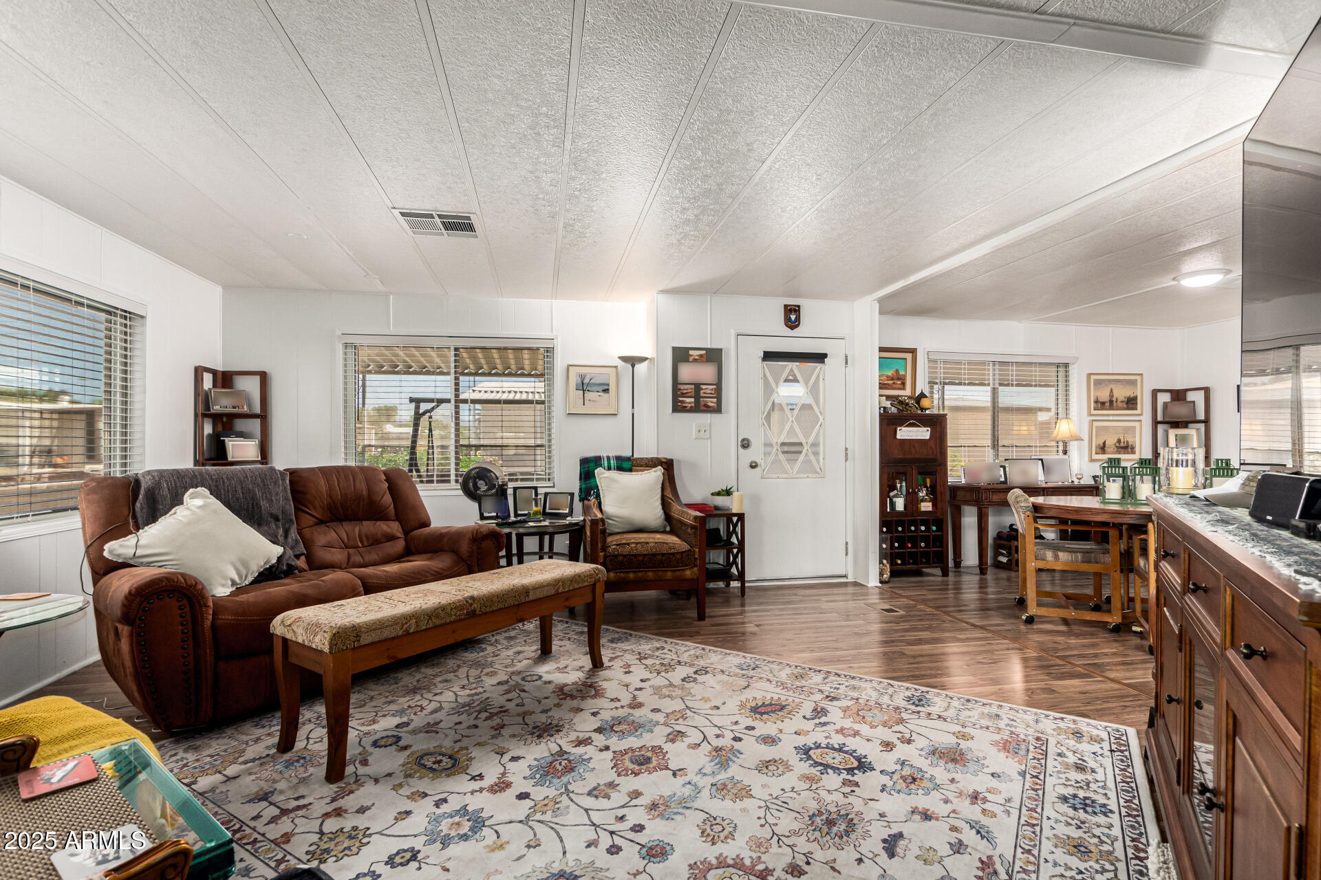 661 South Hawes Road, Unit 52 Mesa, AZ 85208 - Photo 8 of 36 a living room with furniture and a rug